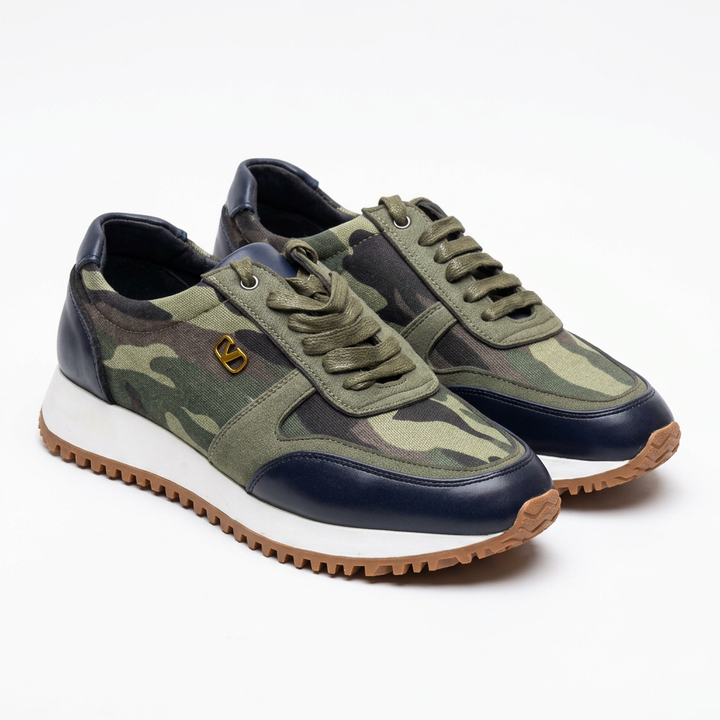 Green camouflage lace-up sneakers with dark toe overlays, white midsoles and tan outsoles on white
