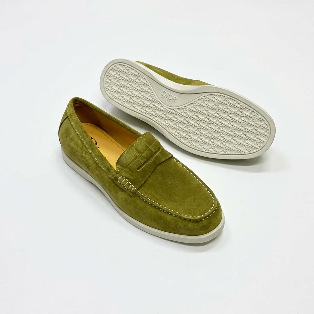 Olive penny loafers with yellow lining, contrast stitching and outsole view on white