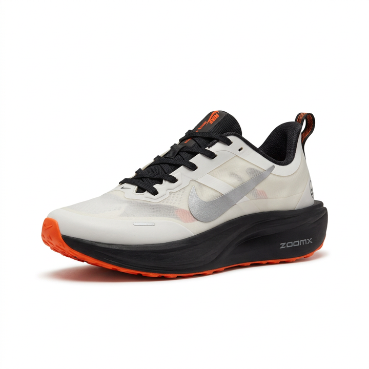 White lace-up sneaker with grey side detail, black sole and orange accents on white background