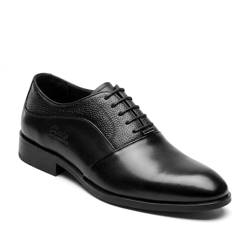 Black formal lace-up shoe with pebbled panels and plain toe on white