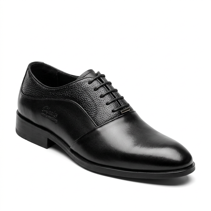 Black formal lace-up shoe with pebbled panels and plain toe on white