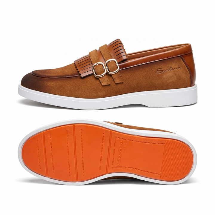Tan double-buckle fringe loafer with white sole and orange outsole view on white