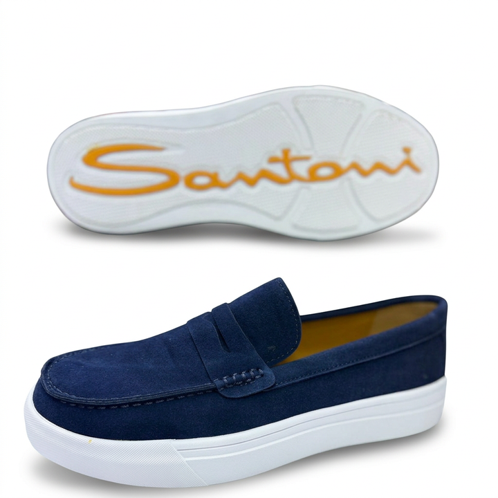 Navy penny loafer with white sole and matching outsole view on white
