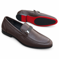Pair of brown slip-on loafers on white background, front shoe upright and second shoe showing red-and-black outsole