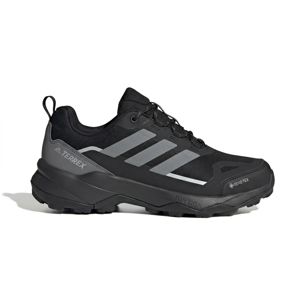 Black trail-style sneaker with grey side stripes and black sole on white