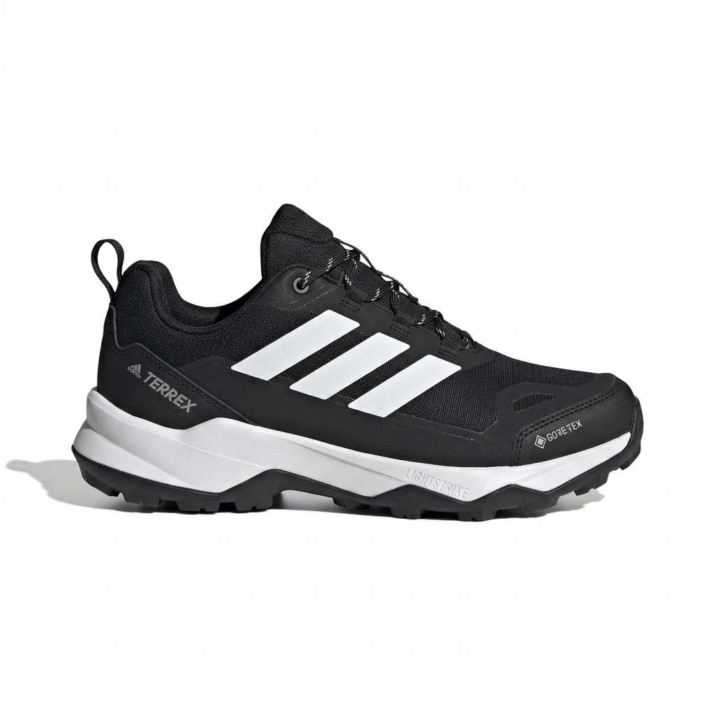 Black trail-style lace-up sneaker with white side stripes and white midsole on white