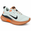 Pale mint lace-up trail running shoe with orange details and rugged outsole on white background