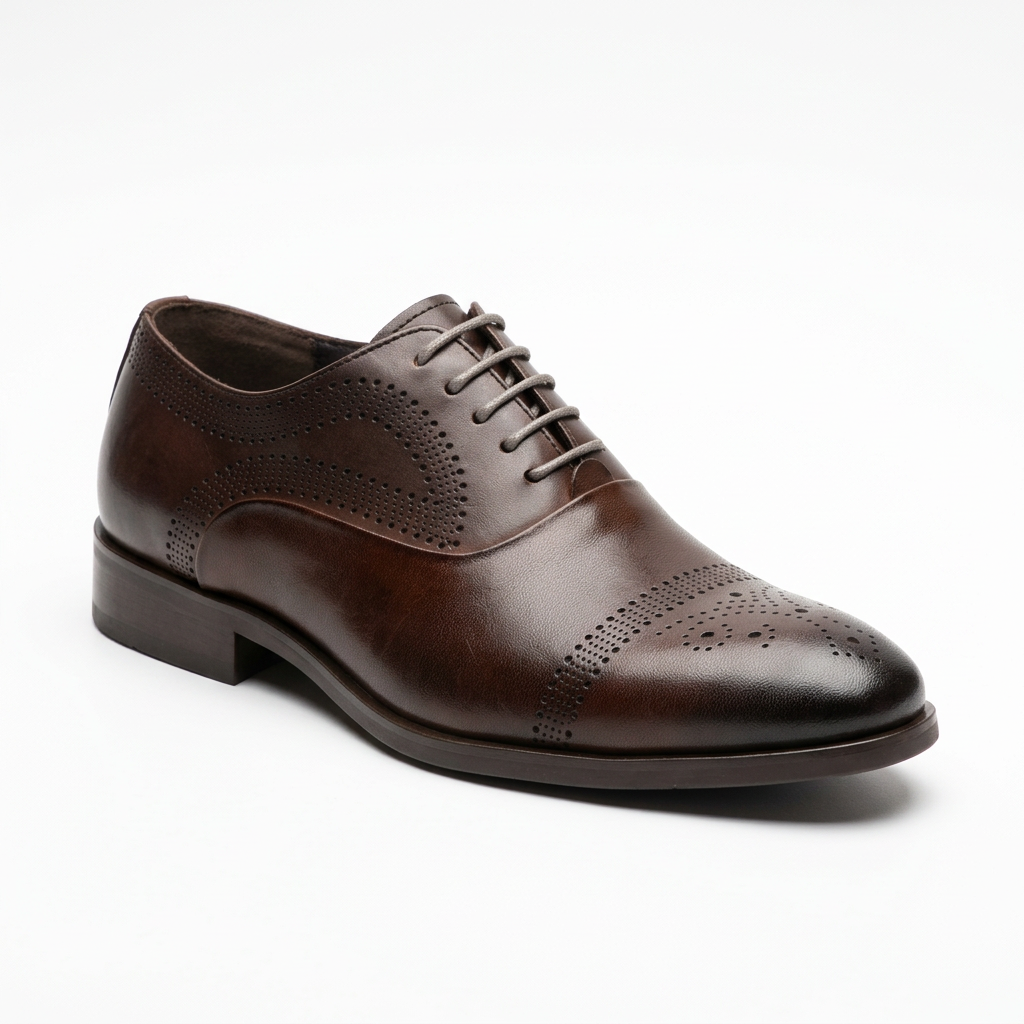 Brown formal lace-up shoe with decorative brogue perforations on white