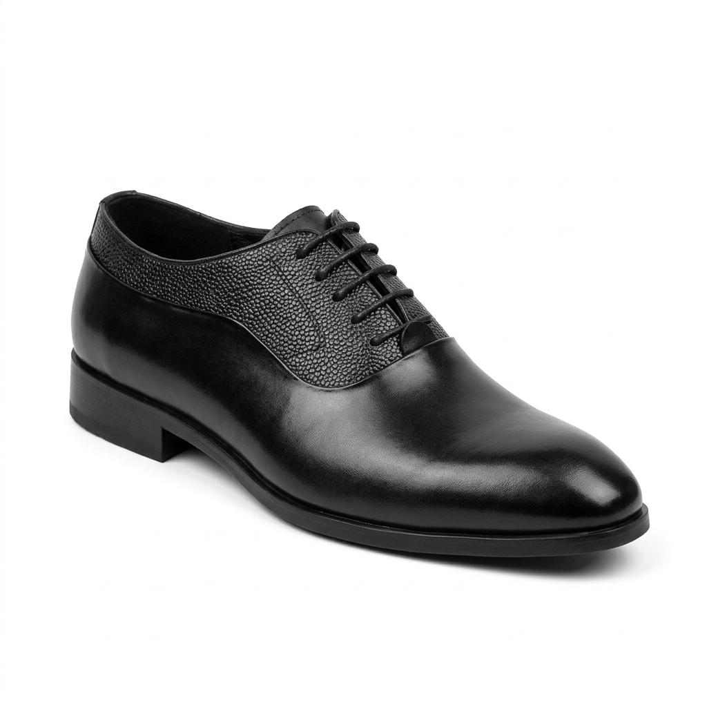 Black formal lace-up shoe with textured lace panels on white