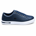 Navy low-top lace-up casual sneaker with perforated upper and white sole on white background