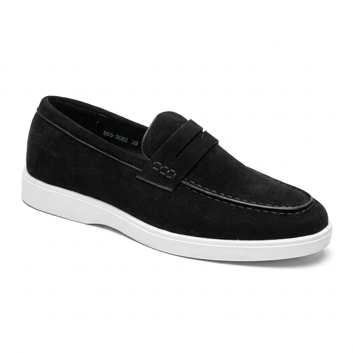 Black men's penny loafer with stitched strap and contrasting white sole on white background