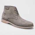 Taupe nubuck chukka boot centered on a neutral studio backdrop with soft shadow